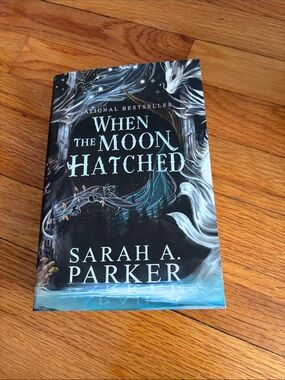 When The Moon Hatched by Sarah A. Parker - Teal & Black Cover